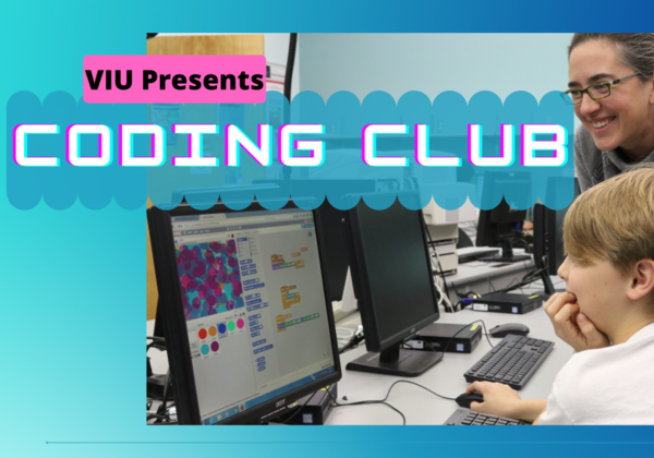 Teacher and student looking at computer