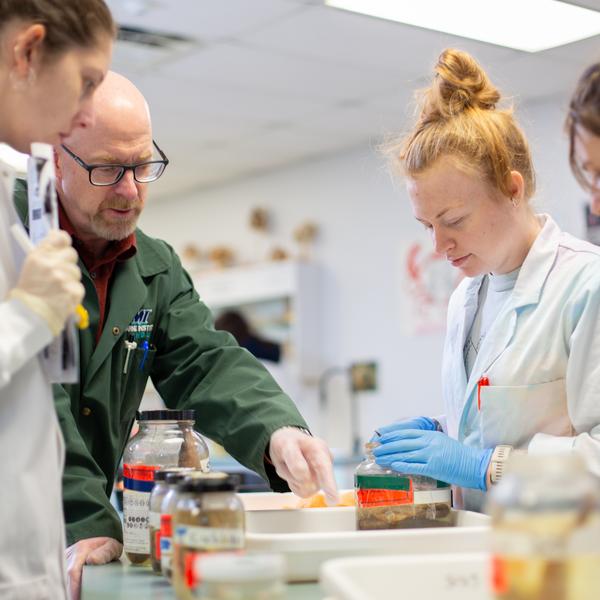 VIU students and professor in the fish biology lab