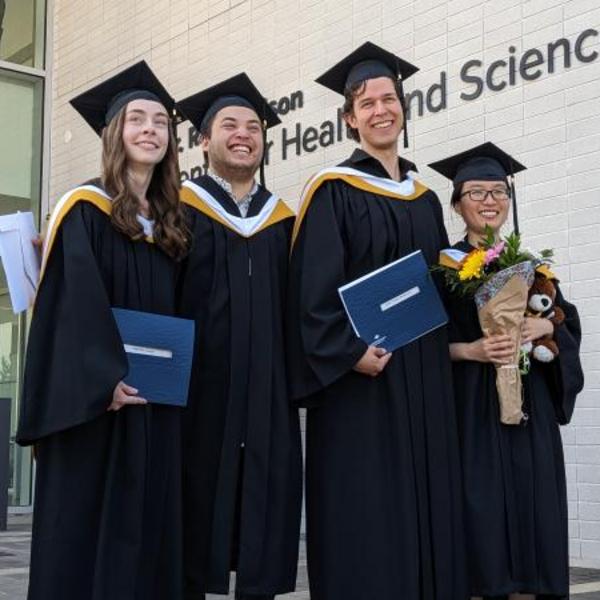 Four VIU chemistry graduates at convocation.