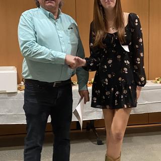 Fish and Aqua student receiving an award in 2024